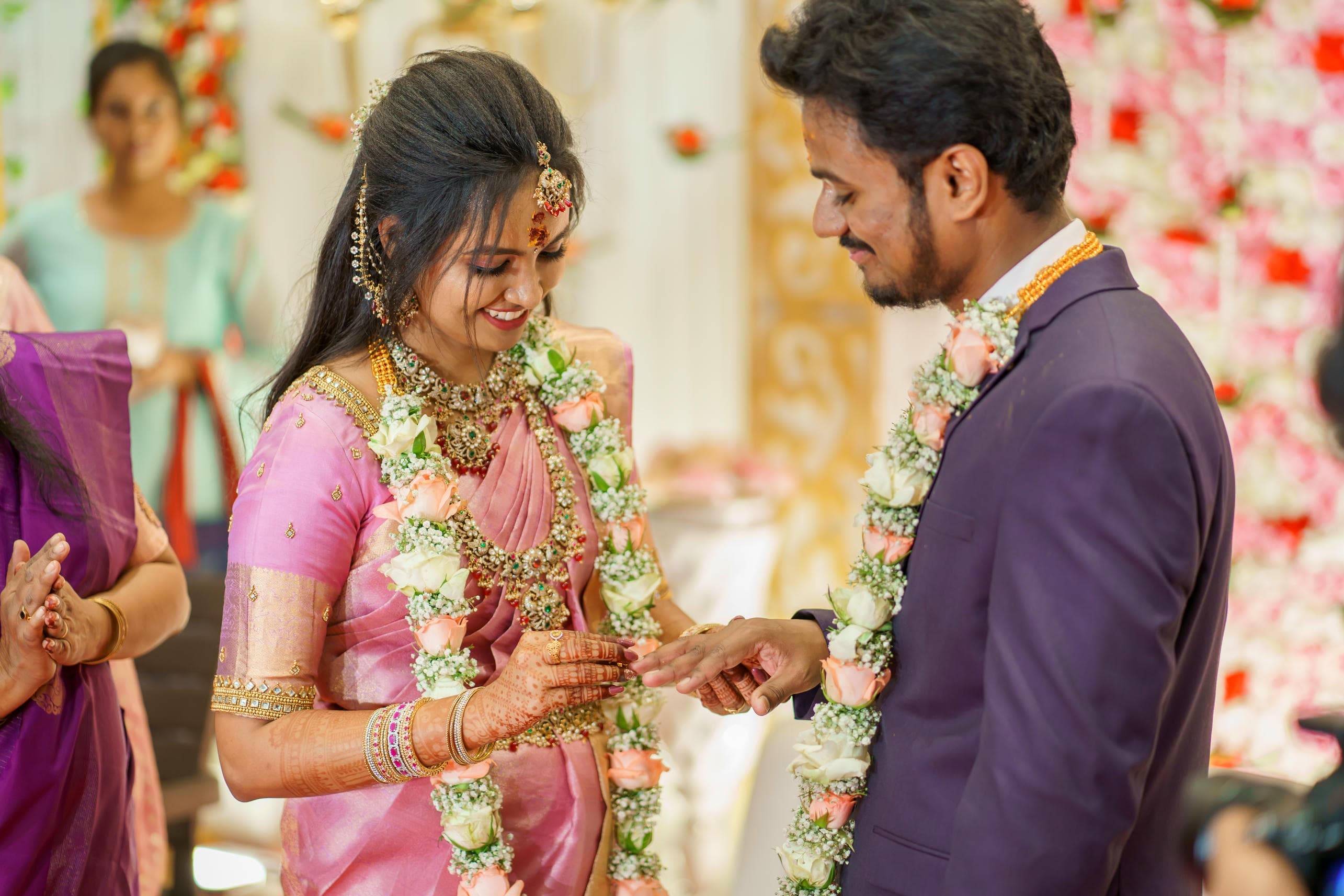 Bride and groom exchanging rings