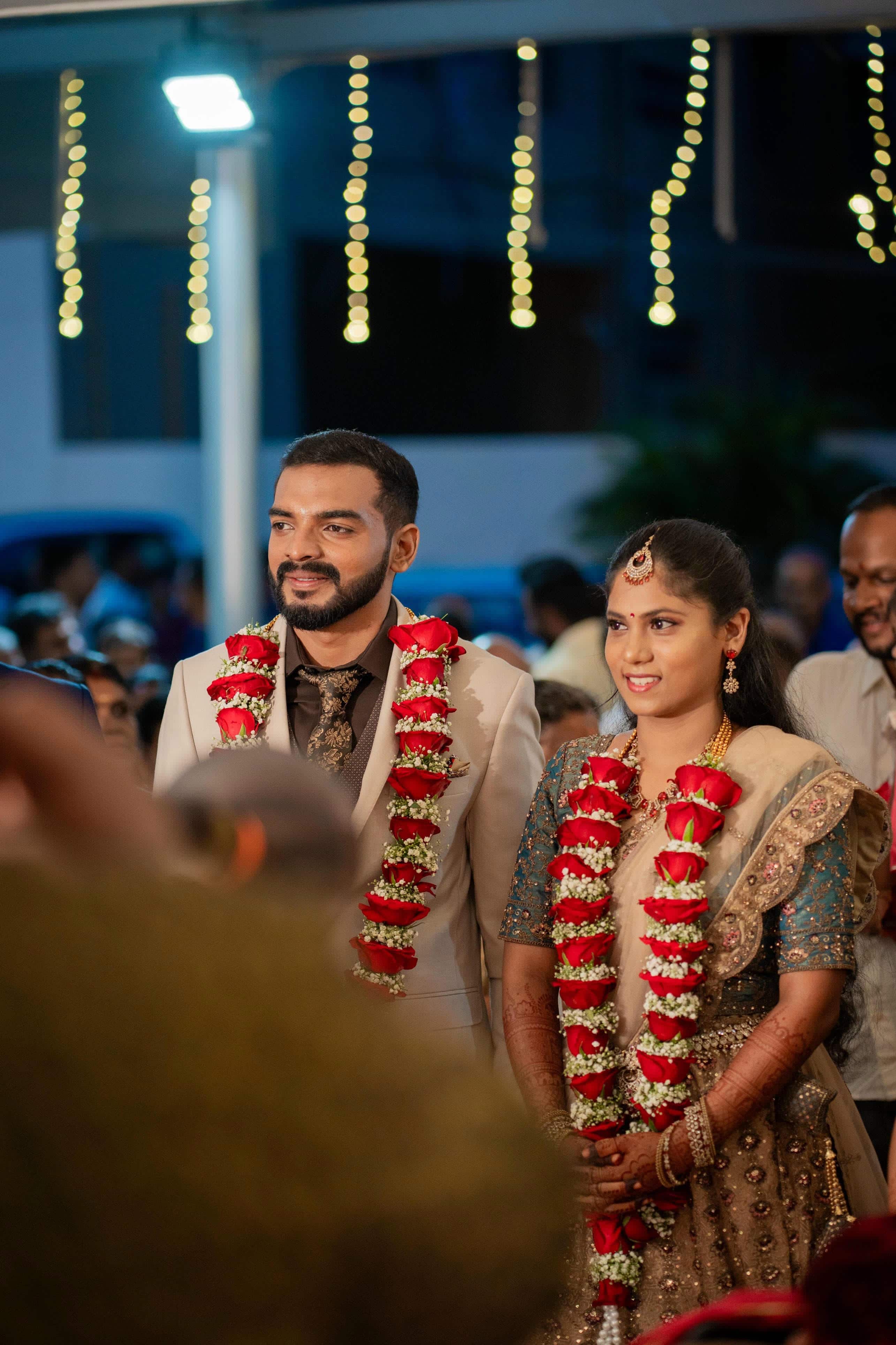 Bride and groom framed by soft evening light