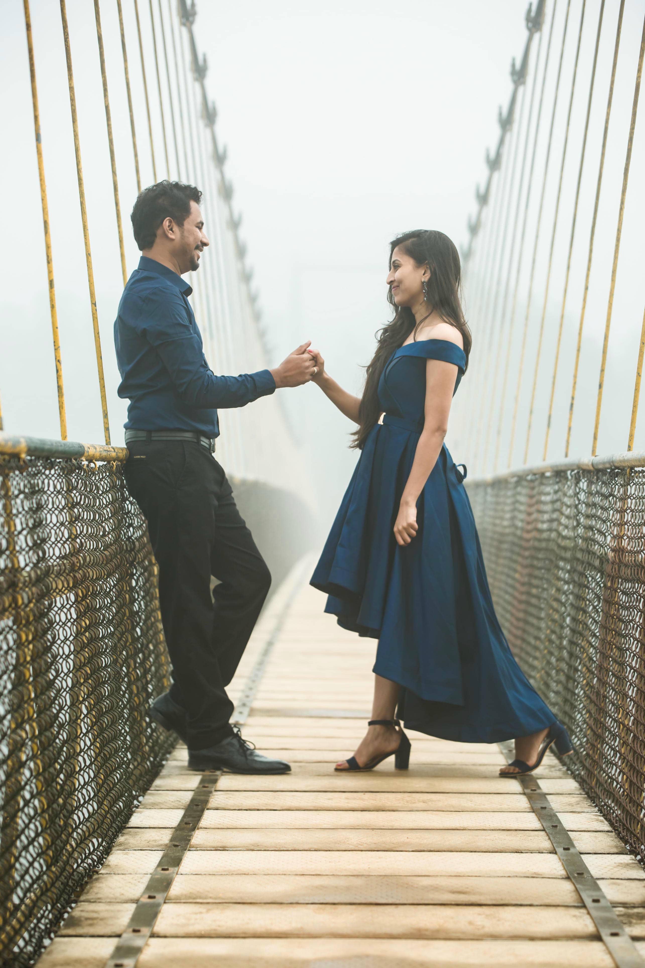Couple holding hands during photoshoot
