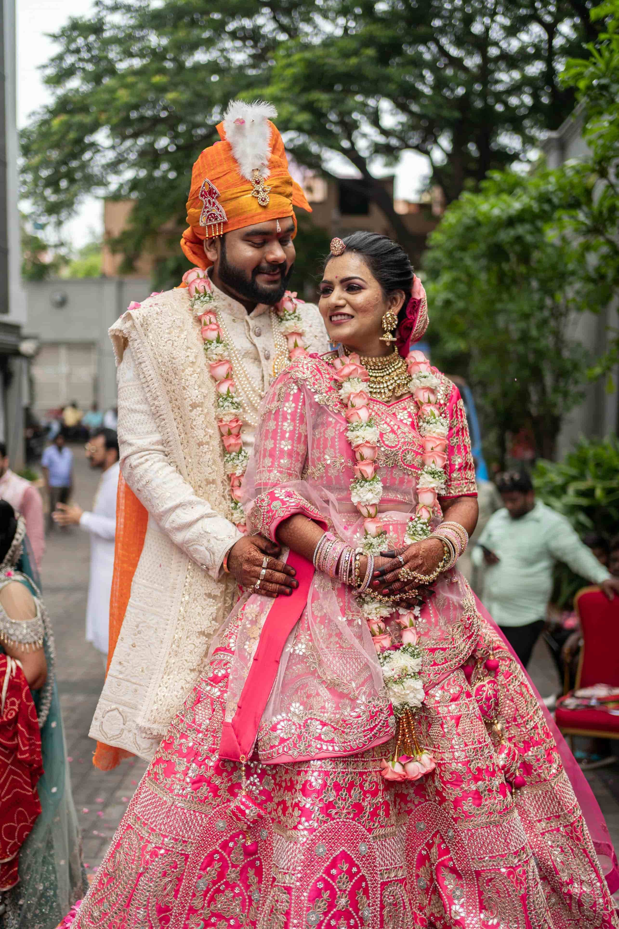 Bride and groom sharing smiles in natural surroundings
