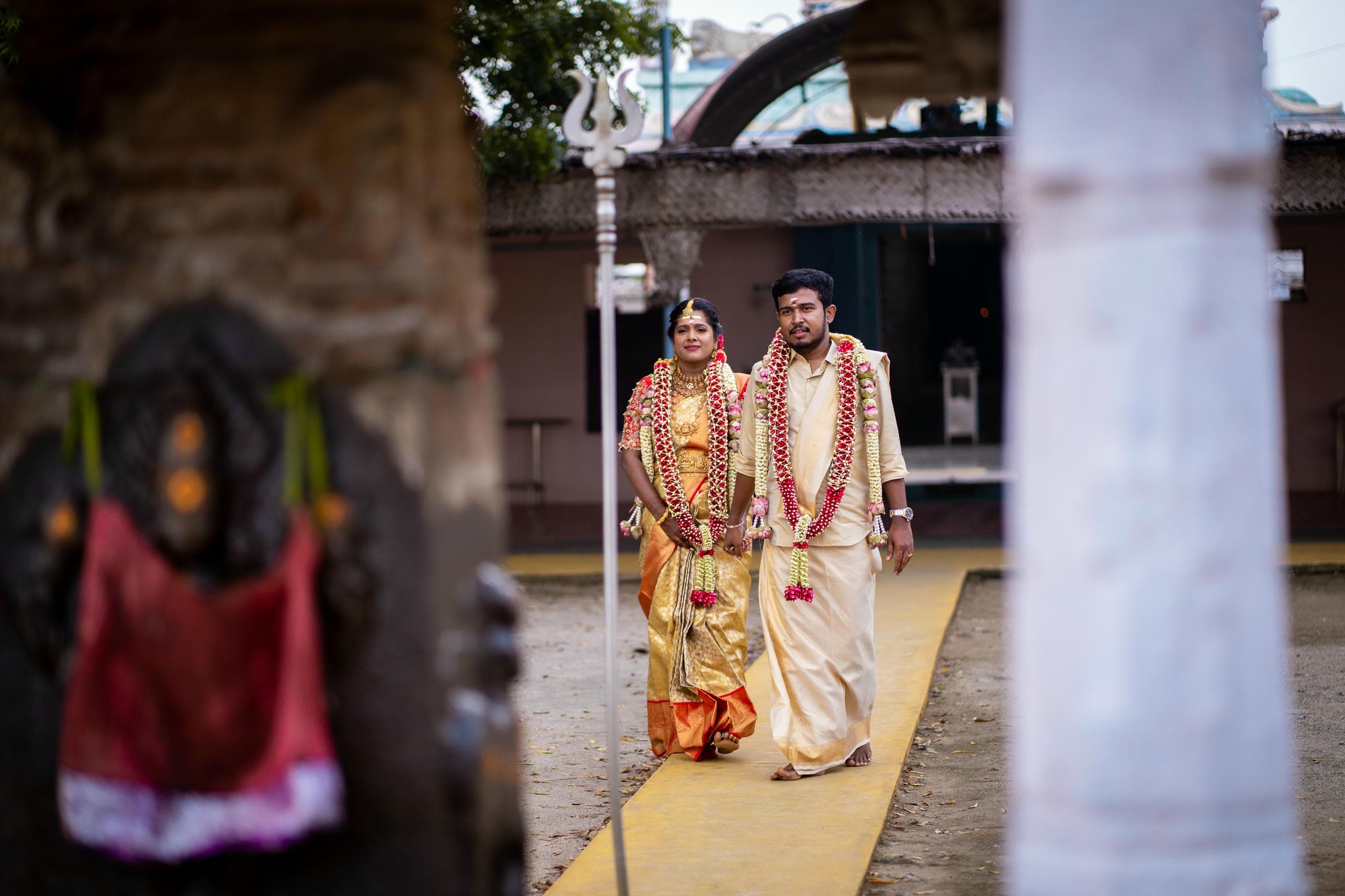 Bride and groom captured with serene temple surroundings