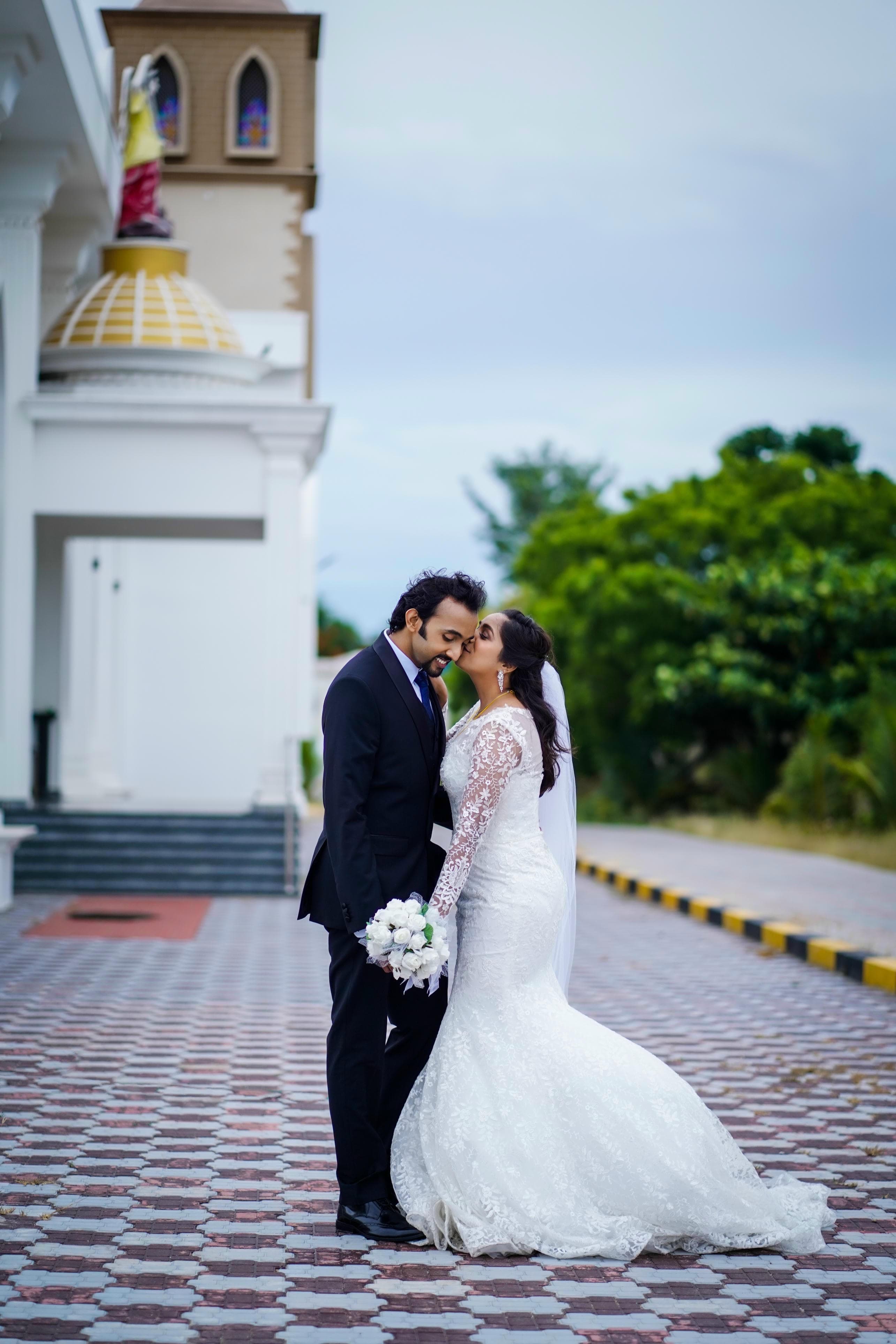 Stylish bride and groom pose
