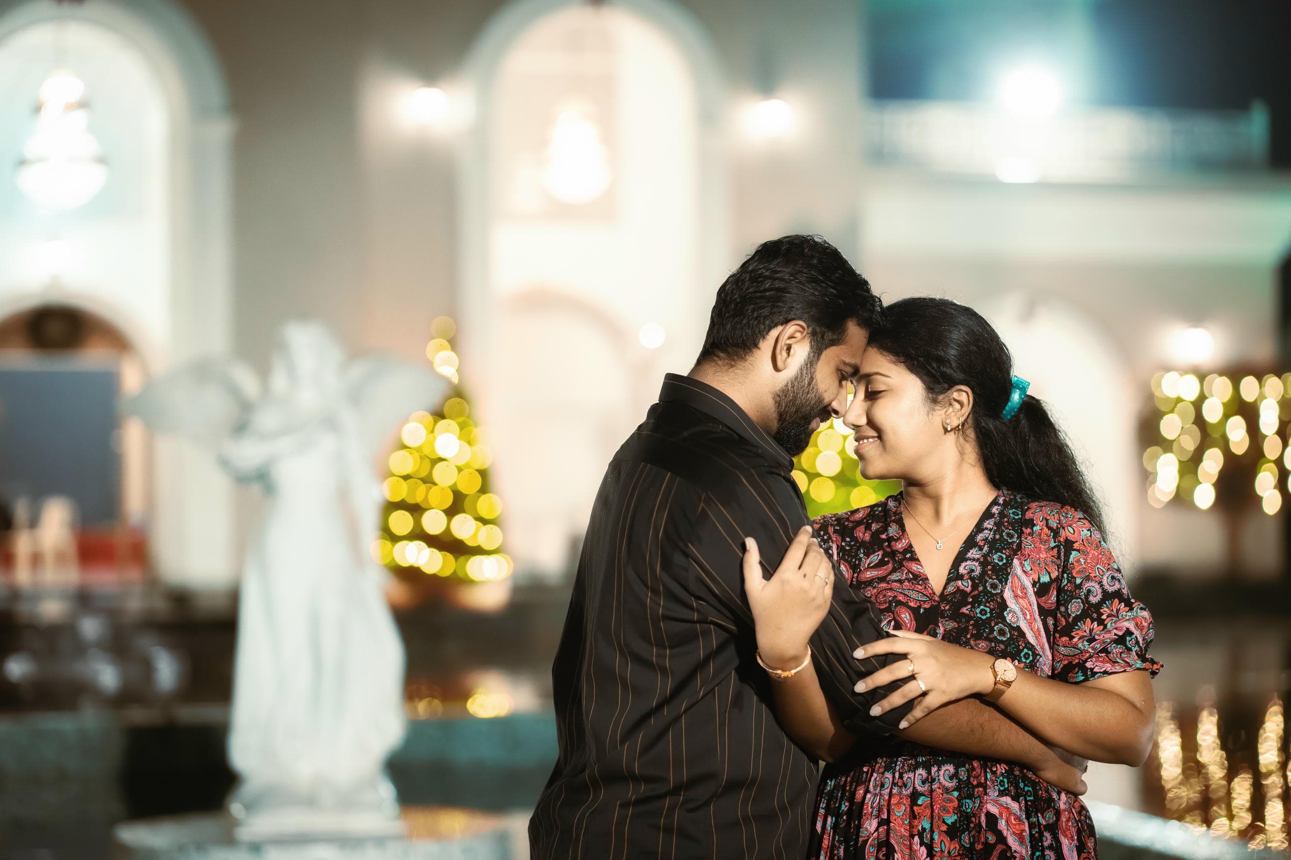 Pre wedding photography poses with a couple touching foreheads